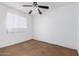 Bedroom featuring a ceiling fan, a window, and blank walls at 4626 W Mitchell Dr, Phoenix, AZ 85031