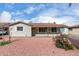 Charming single-story home with light siding, a brown roof, and low-maintenance desert landscaping at 4626 W Mitchell Dr, Phoenix, AZ 85031