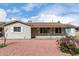 Charming single-story home with light siding, a brown roof, and low-maintenance desert landscaping at 4626 W Mitchell Dr, Phoenix, AZ 85031