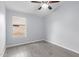 Unfurnished bedroom with tiled floors offers great natural light and a ceiling fan at 5145 W Tonto Rd, Glendale, AZ 85308