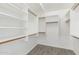 Spacious walk-in closet boasts custom white shelving and wood-grain floors at 5145 W Tonto Rd, Glendale, AZ 85308