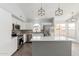 Modern kitchen with an island, stainless steel appliances, and white cabinets at 5145 W Tonto Rd, Glendale, AZ 85308