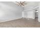 Living room with tile floors, high ceilings, and natural light from the windows at 5145 W Tonto Rd, Glendale, AZ 85308