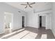 Main bedroom with tile floors, ceiling fan, and access to the bathroom and closets at 5145 W Tonto Rd, Glendale, AZ 85308