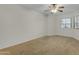 Bedroom with carpet, a ceiling fan, and a bright window at 5230 E Brown Rd # 110, Mesa, AZ 85205