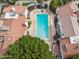 An aerial shot shows a pool surrounded by red tiled homes and mature landscaping at 5326 N 3Rd Ave, Phoenix, AZ 85013