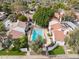 Community aerial view of homes surrounding a pool, mature trees, and landscaped yards at 5326 N 3Rd Ave, Phoenix, AZ 85013