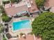 A high angle view shows a pool surrounded by homes, greenery, and patio at 5326 N 3Rd Ave, Phoenix, AZ 85013