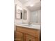 Traditional bathroom vanity with a light wood cabinet, light countertop, and decorative drawer pulls at 5326 N 3Rd Ave, Phoenix, AZ 85013