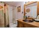 Rustic bathroom with a copper sink, wooden vanity, and decorative shower curtain, blending charm and functionality at 5326 N 3Rd Ave, Phoenix, AZ 85013