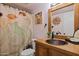 Unique bathroom featuring a copper sink, custom vanity, and artistic shower curtain, adding personality to the space at 5326 N 3Rd Ave, Phoenix, AZ 85013