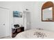 Cozy bedroom featuring a TV, decorative mirror, and a view into a connecting room at 5326 N 3Rd Ave, Phoenix, AZ 85013