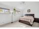 Bright bedroom with a large bed, soft carpet, and hanging plants, creating a serene and inviting atmosphere at 5326 N 3Rd Ave, Phoenix, AZ 85013