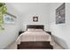 Calm bedroom featuring a plush bed, bedside tables, and natural light, offering a comfortable and relaxing retreat at 5326 N 3Rd Ave, Phoenix, AZ 85013