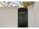 Private black gate entrance with the home number on decorative tiles and surrounding stucco walls at 5326 N 3Rd Ave, Phoenix, AZ 85013