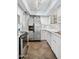 Bright kitchen with stainless steel appliances, white cabinetry, and ample counter space, creating an inviting atmosphere at 5326 N 3Rd Ave, Phoenix, AZ 85013