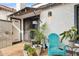 Inviting outdoor patio with a bright blue chair and a collection of potted plants adding natural beauty at 5326 N 3Rd Ave, Phoenix, AZ 85013