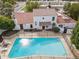 Aerial view of a backyard pool area, enclosed by a fence, with lounge chairs and a well-maintained home exterior at 5326 N 3Rd Ave, Phoenix, AZ 85013