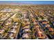 A distant aerial view of a home in a sprawling suburban neighborhood with community amenities at 5433 E Nisbet Rd, Scottsdale, AZ 85254