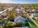 Stunning aerial view of a home featuring a private pool in a lush neighborhood with mountain views at 5433 E Nisbet Rd, Scottsdale, AZ 85254