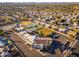 An aerial view of a community featuring neighborhood houses, recreational parks, and local businesses at 5433 E Nisbet Rd, Scottsdale, AZ 85254