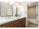 Modern bathroom featuring double vanity, marble countertop, wood cabinets and stylish fixtures at 5433 E Nisbet Rd, Scottsdale, AZ 85254