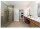 Modern bathroom featuring double vanity with shower and a walk-in closet at 5433 E Nisbet Rd, Scottsdale, AZ 85254