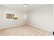 Bright bedroom with neutral carpet and two windows allowing natural light at 5433 E Nisbet Rd, Scottsdale, AZ 85254