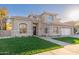 Beautiful two-story home with a well-manicured lawn, three car garage, and elegant design at 5433 E Nisbet Rd, Scottsdale, AZ 85254