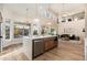 Contemporary kitchen with island, stainless appliances, and view to living room at 5433 E Nisbet Rd, Scottsdale, AZ 85254