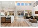 Bright living room featuring wood floors, seamless indoor-outdoor flow, and views of the backyard at 5433 E Nisbet Rd, Scottsdale, AZ 85254