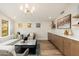 Bright, well-lit living room featuring a long counter, cabinets, and modern finishes at 5433 E Nisbet Rd, Scottsdale, AZ 85254