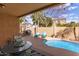 Relaxing backyard pool with lounge chairs and patio furniture at 545 N Bluejay Dr, Gilbert, AZ 85234