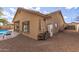 Exterior view of the backyard with pool, covered patio, and desert landscaping at 545 N Bluejay Dr, Gilbert, AZ 85234