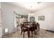 Cozy dining room with wooden furniture and window views, illuminated by a chandelier at 545 N Bluejay Dr, Gilbert, AZ 85234