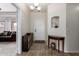 Inviting foyer with tile flooring, console table, and decorative niche, leading into a spacious living area at 545 N Bluejay Dr, Gilbert, AZ 85234