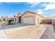 Spacious home with brick driveway, attached two-car garage and well-manicured front yard at 6009 W Questa Dr, Glendale, AZ 85310