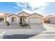 Charming single-story home featuring a two-car garage and well-maintained desert landscaping at 6009 W Questa Dr, Glendale, AZ 85310