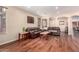 Comfortable living room featuring wood floors, leather sofas and archway accents at 6009 W Questa Dr, Glendale, AZ 85310