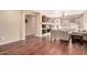 Bright living room with built-in shelving, hardwood floors and neutral paint colors at 6009 W Questa Dr, Glendale, AZ 85310