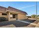 Front entrance of single-story home with desert landscaping and a well-lit walkway leading to the front door at 601 W Yukon Dr # 1, Phoenix, AZ 85027