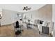 Stylish living room featuring a ceiling fan, wood-look floors, and neutral decor creating a sophisticated atmosphere at 601 W Yukon Dr # 1, Phoenix, AZ 85027