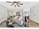 Open-concept living room showcasing modern furnishings, wood-look floors, and a seamless flow into the kitchen at 601 W Yukon Dr # 1, Phoenix, AZ 85027