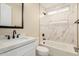 This well-lit bathroom features a shower/tub combo, decorative tile and a built-in niche at 6223 S Eagle Pass Rd, Gold Canyon, AZ 85118