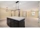 Kitchen island with stone countertop, offering ample storage and food preparation area at 6223 S Eagle Pass Rd, Gold Canyon, AZ 85118