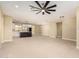 Open concept living space connecting to the kitchen, featuring tile flooring and contemporary ceiling fan at 6223 S Eagle Pass Rd, Gold Canyon, AZ 85118