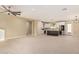 Bright and airy living room with recessed lighting, seamlessly flowing into the modern kitchen area at 6223 S Eagle Pass Rd, Gold Canyon, AZ 85118