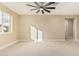 Spacious living room featuring light beige walls and tile flooring at 6223 S Eagle Pass Rd, Gold Canyon, AZ 85118