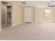 Spacious living room featuring light beige walls and tile flooring at 6223 S Eagle Pass Rd, Gold Canyon, AZ 85118