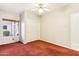 Bedroom featuring a ceiling fan, window, and sliding closet doors at 6460 E Trailridge Cir # 2, Mesa, AZ 85215